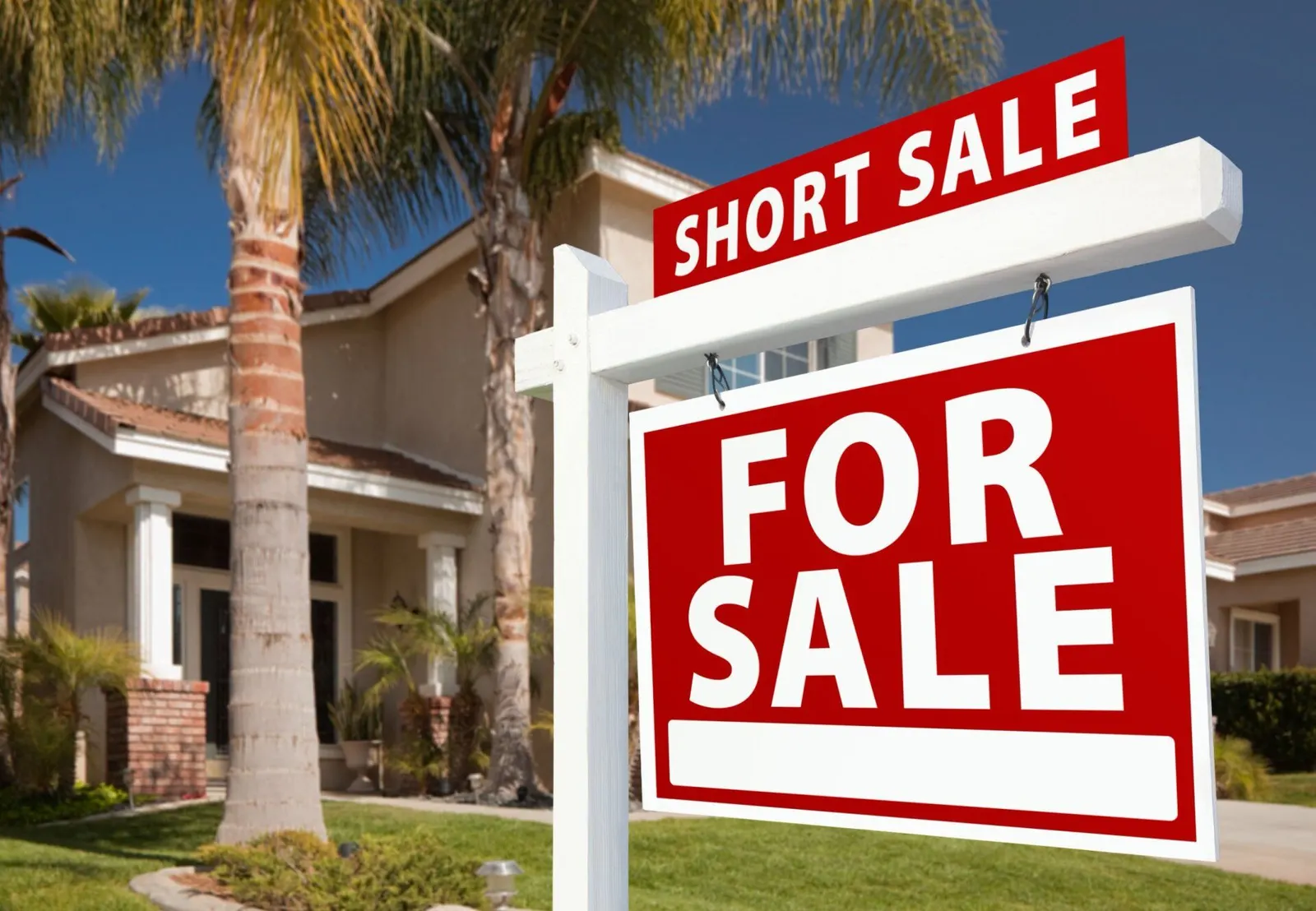 For sale sign and house representing a Rhode Island real estate short sale