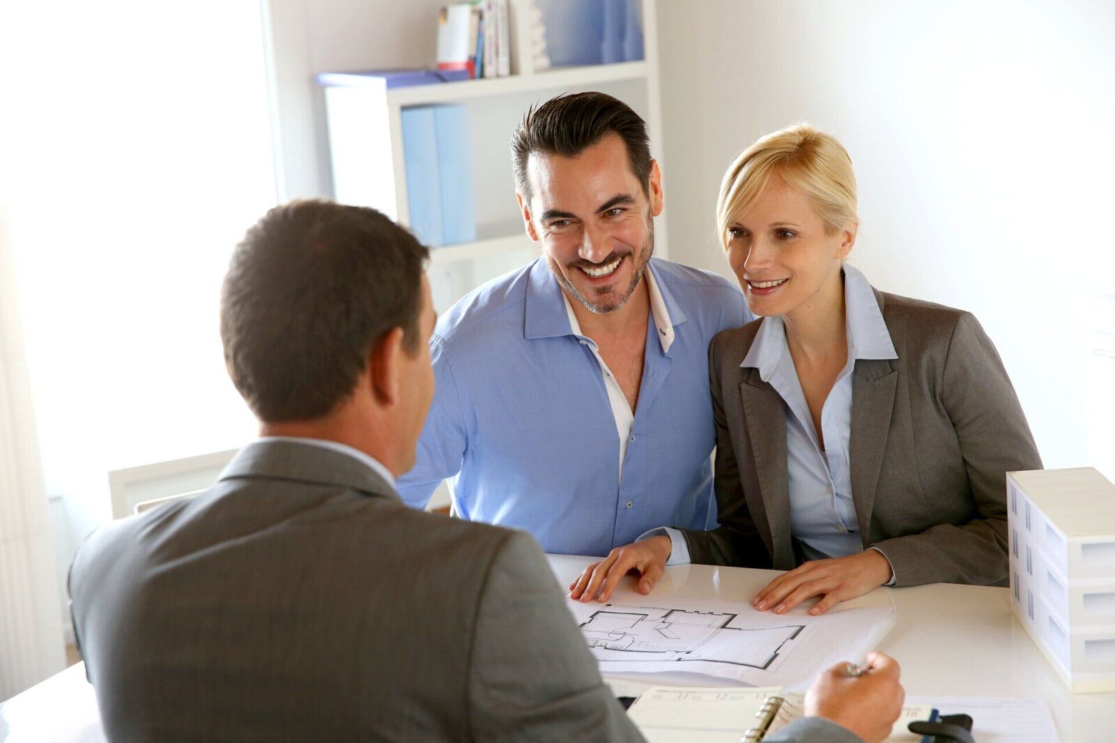 Younger couple meeting with an attorney about a real estate matter